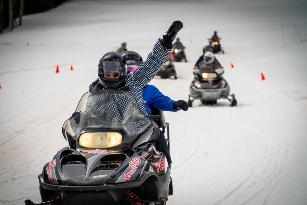 Cuvée guests snowmobiling.