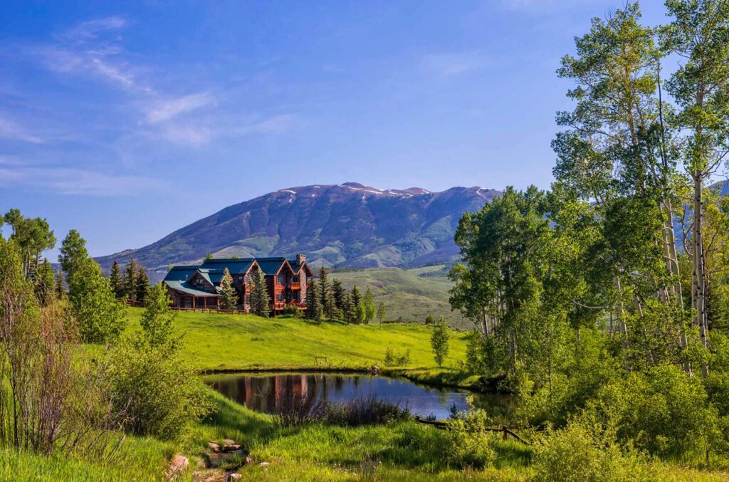 View of Triple C Ranch and mountains in background